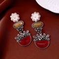 Detailed close-up of vintage floral oval drop earrings with red stones on brown silk background - Three-color Flower Red White Yellow (Vintage Silver Needle)