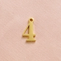Detailed view of a gold-plated stainless steel number 4 pendant with polished finish - Gold Number 4