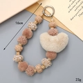 Plush heart beaded phone strap and keychain accessory with 16cm length and soft pom-poms - Khaki