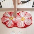 Floral tufted bath mat with non-slip backing in vibrant red and pink flower shape - Pink