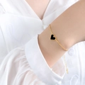 Golden bracelet with black heart charm and beaded edge detailing for women - Gold Black Acrylic Bracelet