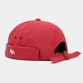 Detail of red canvas docker hat featuring fox embroidery and adjustable brown strap - Adjustable / Red