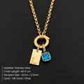 Collar de acero inoxidable dorado con colgante de letra L y cristal azul SKU - Dorado / L