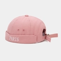 Close-up of pink canvas docker hat featuring white PARIS embroidery on the folded brim - Dusty Pink