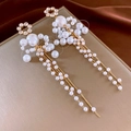 Detailed view of pearl tassel earrings with golden chains on a luxury silk background - Pearl Tassel Drop Earrings (Silver Earring Post)