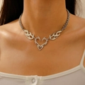 Vintage silver hollow heart locket necklace with flame design worn by a model - Stainless Steel and Alloy / Steel Color Flame Hollow Heart (11903)