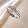 Silver stainless steel heart bangle with crystal pave setting on champagne silk - Steel