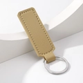 Minimalist beige PU leather car keychain with silver metal ring on white stand - Rectangle / Khaki