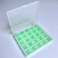 25 Green Bobbins In A 25-compartment Box / Shuttle Core Storage Box