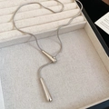 Macro shot of polished silver waterdrop pendant with snake chain on jewelry box - Teardrop Pendant (HN10144) / Silver