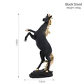 Rearing black horse figurine with gold details on a rock base for home decor - 30x19cm / Black and Gold Rearing Horse