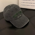 Detailed close-up of vintage charcoal wash baseball cap with green New York embroidery - One Size / Army Green