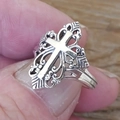 Retro gothic hollow cross ring with vintage silver finish held in hand on wooden background - US 7 / Antique Silver