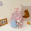 Pink cartoon kids backpack with blue checkered pocket and plush rabbit charm - Pink