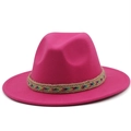 Detail of rose red wool fedora hat featuring a colorful woven rainbow band and wide brim - Rose Red