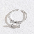 Bague ajustable en argent S925 avec design papillon en zircon et fini brillant - Noeud Plaqué Or Blanc