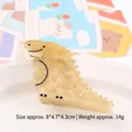 Schattige beige dinosaurus haarklem van acryl met marmertextuur voor minimalistische look - Lichtgeel Getextureerde Dinosaurus / Off-white (Dinosaurusvorm)