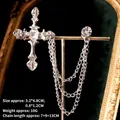 Macro shot of silver gothic cross collar pin with rhinestones and triple tassel chains - Silver Cross Style (TL24059)