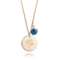 Detail of rose gold necklace with blue birthstone and engraved floral disc pendant - December Holly