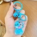 Sky blue liquid quicksand Hello Kitty schoolbag keychain with acrylic pendant - Blue Hello Kitty Milk Bean