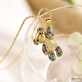 Detailed macro view of gold teddy bear pendant set with colorful sparkling zircons - Colorful Zircon Bear (23643)