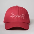 Detail of red cotton baseball cap with white cursive Husbands embroidery and stitching - One Size / Red