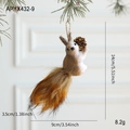 Brown foam squirrel ornament holding a pine cone with natural fiber hanging string - Squirrel Pendant Type E
