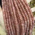Close-up of semi-transparent strawberry quartz abacus beads for DIY jewelry making - Optimize Sunstone / 5*8mm (approx. 73 pcs/strand)