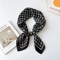 Elegant black and white geometric square silk scarf tied in a stylish knot wrap - Geometric G Pattern Black