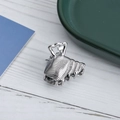 Sleek silver metal mini hair claw clip with textured horizontal stripes on white wood - Striped Shell / Silver