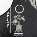 Silver turtle keychain with four charms and 9.4cm length measurement on black leather - Ancient Silver Turtle Keychain-LS268