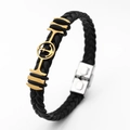 Detail of black braided leather bracelet with gold anchor and silver magnetic clasp - Anchor