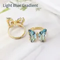 Adjustable gold butterfly ring featuring light blue gradient crystals and micro diamonds - Light Blue Gradient