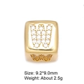 Macro shot of 9mm gold-plated letter W bead with cubic zirconia for DIY jewelry - Letter W