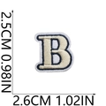 Detail of letter B embroidery patch with size measurements in cream and navy - B (Beige)