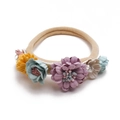 Detail of baby floral headband with elastic nylon band and pastel fabric flowers - Style 02