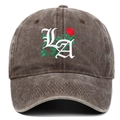 Close-up of gothic LA letter embroidery and red rose detail on brown washed cotton cap - Coffee