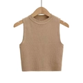 Detail of camel knitted sleeveless tank top fabric on a wooden hanger with white backdrop - Tan