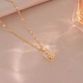 Rotating daisy flower necklace in golden heart pendant with sparkling white zircon stones - X3730 Rotating Heart / Gold