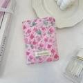 Pink quilted fabric passport holder with tulip pattern shown in a lifestyle desk setting - Pink Tulip