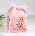 Detailed close-up of pink laser-cut heart candy box with matching satin ribbon for weddings - Pink
