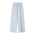 Detail of light blue wide-leg trousers showing elastic drawstring waist and ribbed texture - Blue Pants