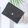 Cute black faux leather coin purse with golden clasp and chain on a white display stand - Black