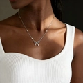 Elegant stainless steel silver bow pendant necklace with beaded chain on female model - Silver Bowknot Bead Chain Necklace (X191)