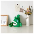 Detail shot of a green cartoon shark chest bag for boys on a bright white surface - Green