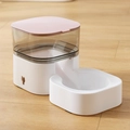 Pink gravity pet feeder with white base and gray container on light wooden floor - Pet Feeder / Pink