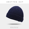 Classic knitted beanie in deep navy blue featuring thick ribbed texture for winter warmth - One Size / Navy Blue