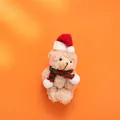 Plush Christmas bear with red scarf and hat on orange background variant - Brown Bear Style A (Red Green Striped Scarf)