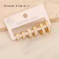 Detail of three pairs of golden stainless steel hoop earrings with double-row crystals - 9# 2-Row Drill Round Gold