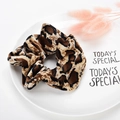 Leopard print velvet scrunchie on decorative ceramic tray for elegant hair styling - Style 12 Coffee Leopard
